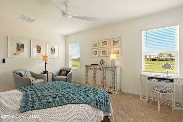 3547 Aberdeen Dr SE, Palm Bay, FL 32909 - bedroom with light colored carpet, a ceiling fan, and baseboards