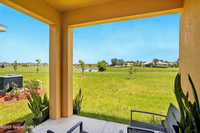 3547 Aberdeen Dr SE, Palm Bay, FL 32909 - view of green lawn with central air condition unit and a water view