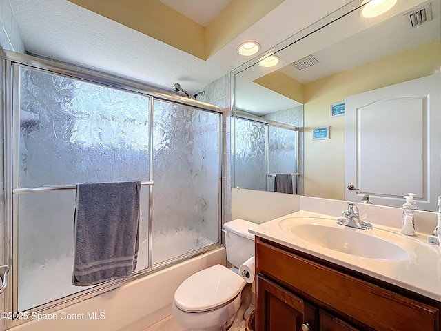 2050 SE Ellington Ter, Port St Lucie, FL 34952 - full bathroom with enclosed tub / shower combo, toilet, and vanity