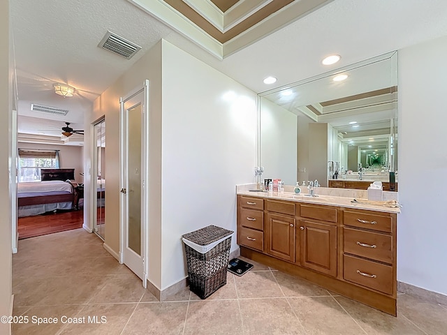 2050 SE Ellington Ter, Port St Lucie, FL 34952 - bathroom with ensuite bath, vanity, tile patterned flooring, a ceiling fan, and baseboards