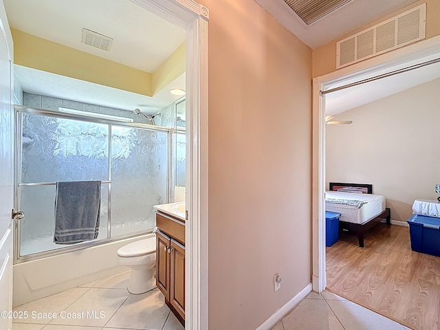 2050 SE Ellington Ter, Port St Lucie, FL 34952 - full bath featuring tile patterned floors, enclosed tub / shower combo, toilet, and vanity