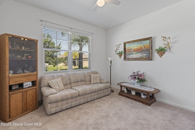 4015 Harvest Cir, Rockledge, FL 32955 - living room with light colored carpet, ceiling fan, and baseboards