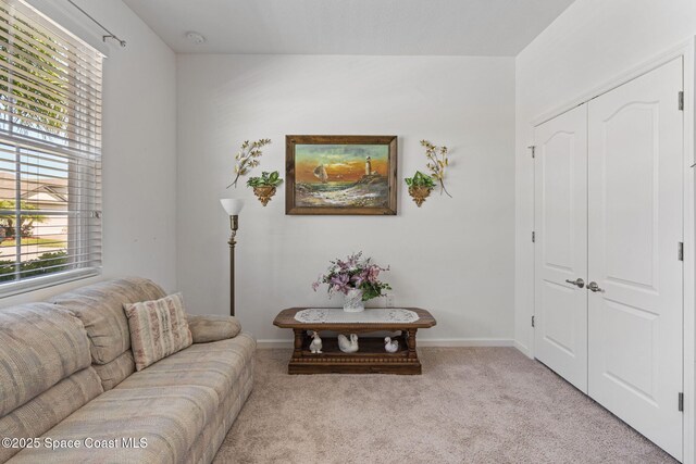 4015 Harvest Cir, Rockledge, FL 32955 - living room with light carpet and baseboards