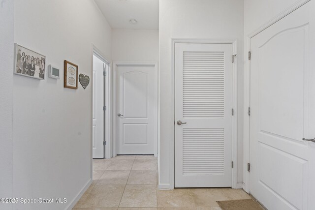 4015 Harvest Cir, Rockledge, FL 32955 - hall with baseboards and light tile patterned flooring
