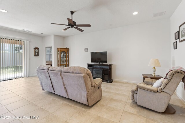 4015 Harvest Cir, Rockledge, FL 32955 - living area featuring light tile patterned flooring, a ceiling fan, recessed lighting, and baseboards