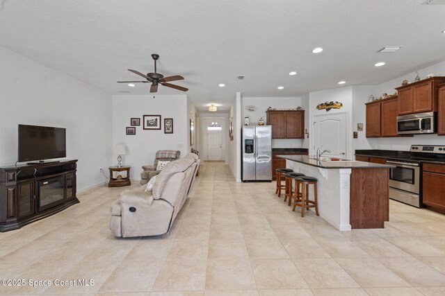 4015 Harvest Cir, Rockledge, FL 32955 - living area with recessed lighting, light tile patterned flooring, and ceiling fan