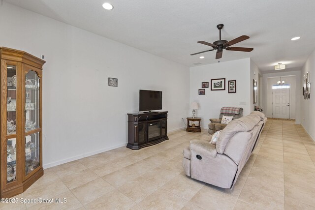 4015 Harvest Cir, Rockledge, FL 32955 - living area featuring recessed lighting, light tile patterned flooring, ceiling fan, and baseboards