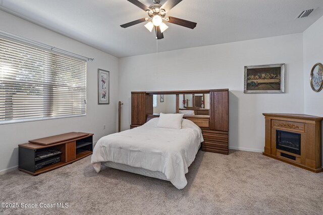 4015 Harvest Cir, Rockledge, FL 32955 - bedroom with carpet, baseboards, and ceiling fan