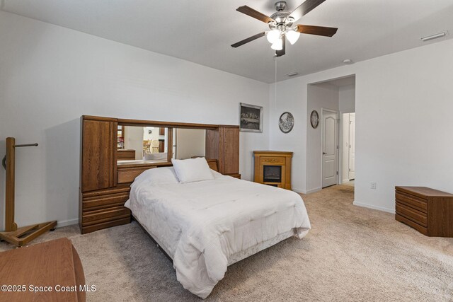 4015 Harvest Cir, Rockledge, FL 32955 - bedroom featuring light carpet, baseboards, and ceiling fan