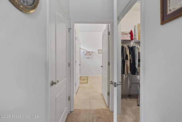4015 Harvest Cir, Rockledge, FL 32955 - corridor featuring light carpet and light tile patterned floors