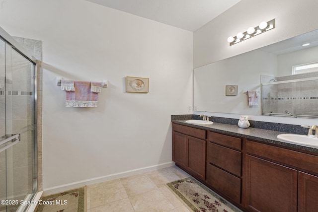 4015 Harvest Cir, Rockledge, FL 32955 - bathroom featuring a stall shower, double vanity, tile patterned floors, and baseboards