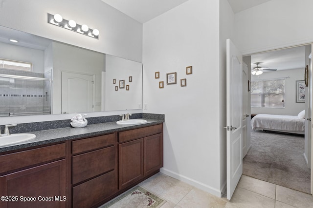 4015 Harvest Cir, Rockledge, FL 32955 - bathroom with double vanity, ensuite bathroom, a stall shower, and tile patterned flooring