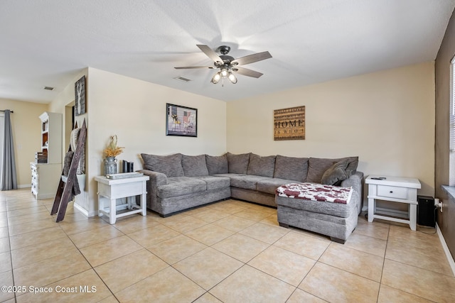 946 Stage St SE, Palm Bay, FL 32909 - living room with ceiling fan, light tile patterned flooring, and baseboards