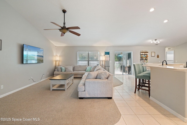 4070 Orion Way, Rockledge, FL 32955 - living room with a ceiling fan, lofted ceiling, baseboards, light tile patterned floors, and recessed lighting