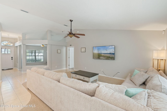 4070 Orion Way, Rockledge, FL 32955 - living room featuring a ceiling fan, baseboards, light tile patterned floors, and high vaulted ceiling