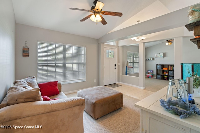 4070 Orion Way, Rockledge, FL 32955 - living room featuring a ceiling fan, lofted ceiling, light carpet, healthy amount of natural light, and light tile patterned floors