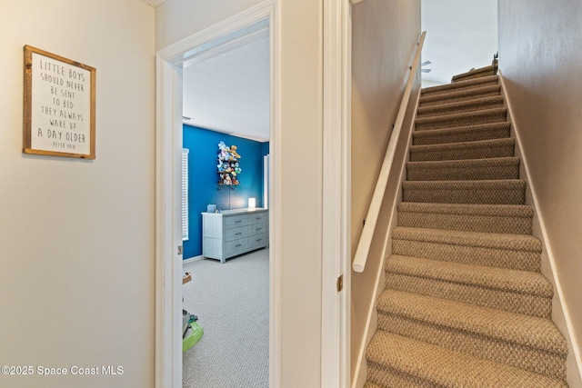 4070 Orion Way, Rockledge, FL 32955 - stairway featuring carpet flooring and baseboards