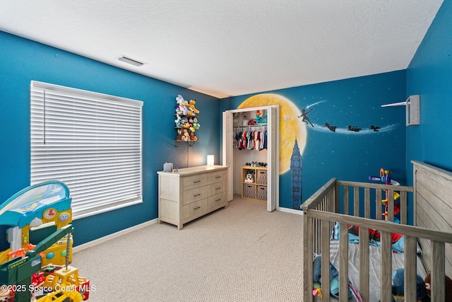 4070 Orion Way, Rockledge, FL 32955 - bedroom featuring carpet floors, baseboards, a textured ceiling, and a nursery area