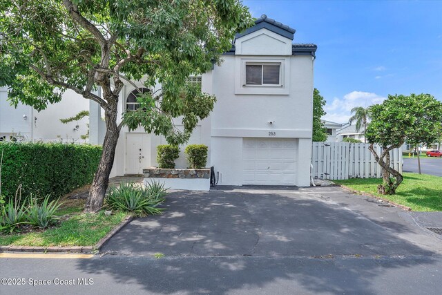 253 NE 212th Ter, Miami, FL 33177 - view of front of property featuring a garage, stucco siding, driveway, and a tiled roof