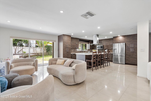 253 NE 212th Ter, Miami, FL 33177 - living room with plenty of natural light, recessed lighting, and light tile patterned floors