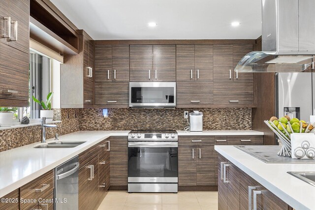 253 NE 212th Ter, Miami, FL 33177 - kitchen featuring stainless steel appliances, a sink, tasteful backsplash, island range hood, and recessed lighting