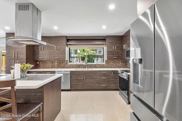 253 NE 212th Ter, Miami, FL 33177 - kitchen with stainless steel appliances, island exhaust hood, a sink, modern cabinets, and light countertops