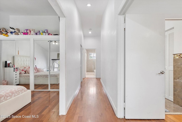 253 NE 212th Ter, Miami, FL 33177 - hall featuring wood finished floors, recessed lighting, and baseboards