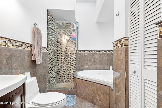 253 NE 212th Ter, Miami, FL 33177 - full bathroom with tile walls, a closet, toilet, a stall shower, and a garden tub
