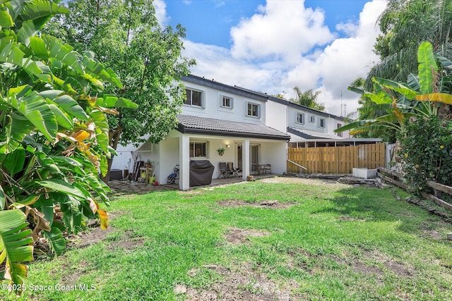 253 NE 212th Ter, Miami, FL 33177 - rear view of house with stucco siding, a patio area, and a tiled roof