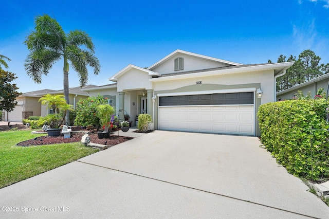2263 Chinaberry Cir SE, Palm Bay, FL 32909 - single story home with a garage, concrete driveway, stucco siding, and a front yard