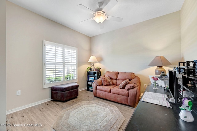 2263 Chinaberry Cir SE, Palm Bay, FL 32909 - living area with wood finished floors, ceiling fan, and baseboards