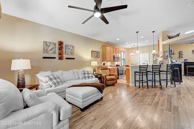 2263 Chinaberry Cir SE, Palm Bay, FL 32909 - living area with ceiling fan, light wood-style flooring, and recessed lighting