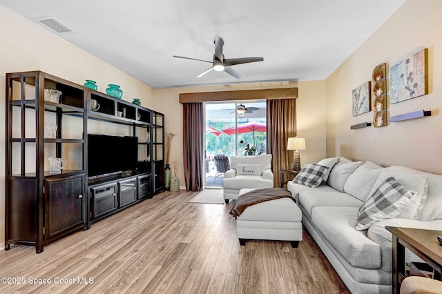 2263 Chinaberry Cir SE, Palm Bay, FL 32909 - living room featuring ceiling fan and light wood-type flooring