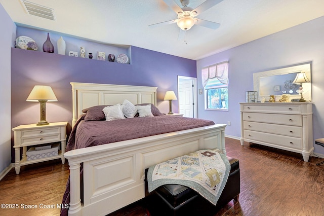 2263 Chinaberry Cir SE, Palm Bay, FL 32909 - bedroom with dark wood-type flooring, baseboards, and a ceiling fan