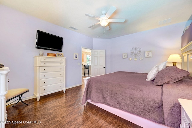 2263 Chinaberry Cir SE, Palm Bay, FL 32909 - bedroom with wood finished floors, a ceiling fan, and baseboards