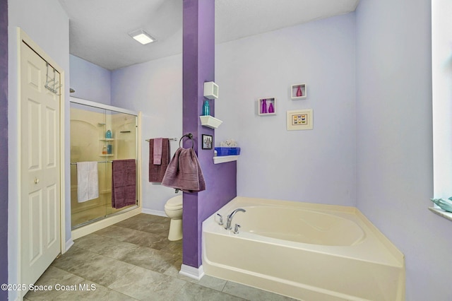 2263 Chinaberry Cir SE, Palm Bay, FL 32909 - bathroom featuring toilet, a bath, a shower stall, baseboards, and tile patterned flooring