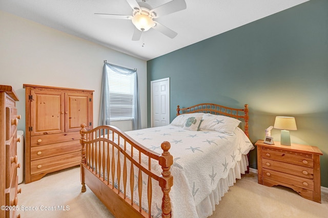 2263 Chinaberry Cir SE, Palm Bay, FL 32909 - bedroom featuring light colored carpet, ceiling fan, and a closet