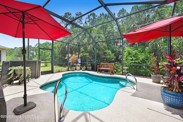 2263 Chinaberry Cir SE, Palm Bay, FL 32909 - outdoor pool with a patio area and glass enclosure