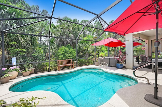 2263 Chinaberry Cir SE, Palm Bay, FL 32909 - swimming pool featuring a patio and glass enclosure