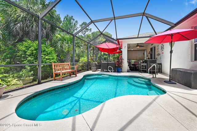 2263 Chinaberry Cir SE, Palm Bay, FL 32909 - swimming pool with a patio area, ceiling fan, and a lanai