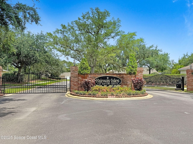 2263 Chinaberry Cir SE, Palm Bay, FL 32909 - community / neighborhood sign with a gate