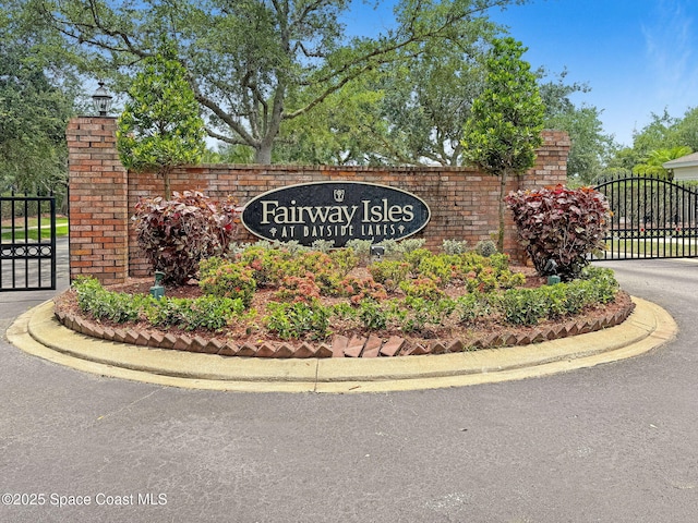 2263 Chinaberry Cir SE, Palm Bay, FL 32909 - community sign with a gate