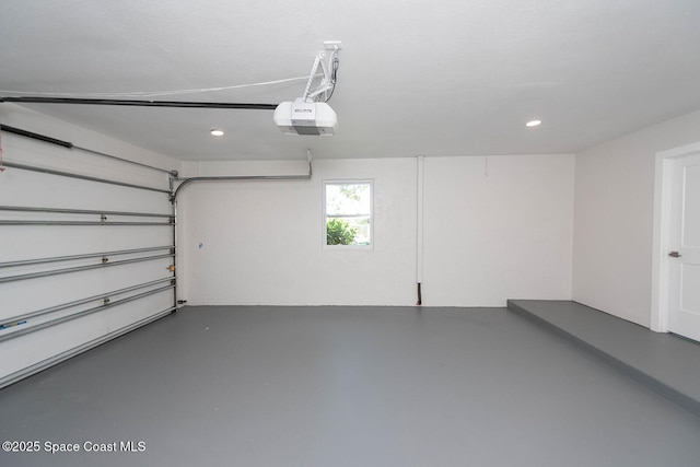 3201 Nottingham Ln, Cocoa, FL 32926 - garage with a garage door opener and recessed lighting