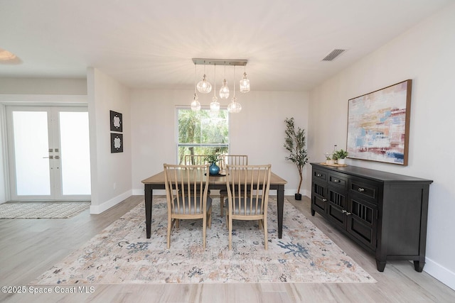 3201 Nottingham Ln, Cocoa, FL 32926 - dining area with light wood-type flooring and french doors