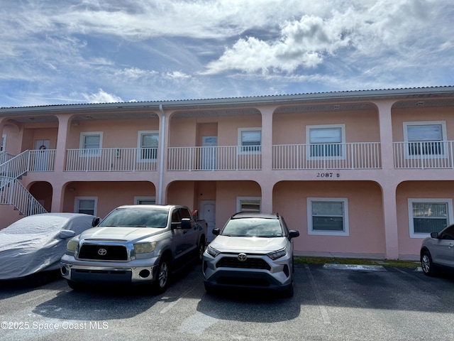 2087 Hidden Grove Ln Unit 208, Merritt Island, FL 32953 - view of property with uncovered parking