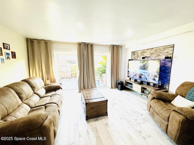 930 S Colonial Ct Unit 119, Indian Harbour Beach, FL 32937 - living area with light wood-style flooring