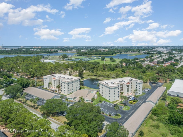 1410 Huntington Ln Unit 1204, Rockledge, FL 32955 - bird's eye view of apartment complex / building, a nearby body of water, and a tree filled landscape
