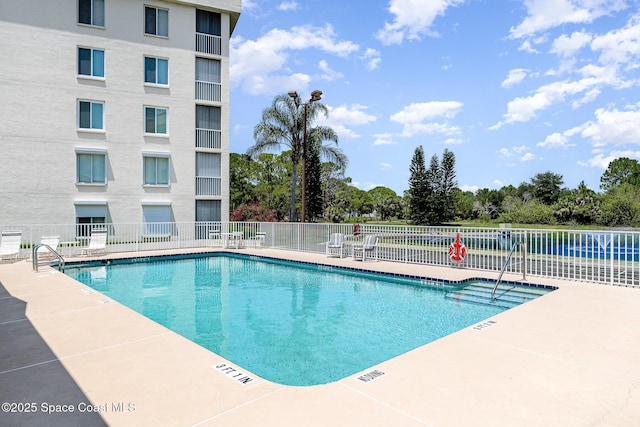 1410 Huntington Ln Unit 1204, Rockledge, FL 32955 - community pool with a patio