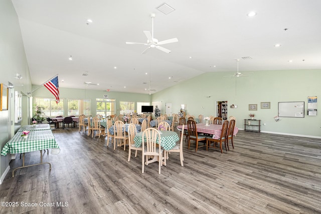 1410 Huntington Ln Unit 1204, Rockledge, FL 32955 - dining room with ceiling fan, wood finished floors, recessed lighting, baseboards, and high vaulted ceiling
