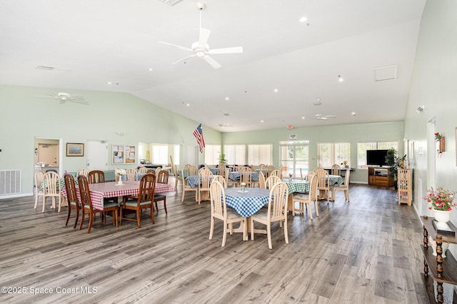 1410 Huntington Ln Unit 1204, Rockledge, FL 32955 - dining space with ceiling fan, light wood-type flooring, and high vaulted ceiling